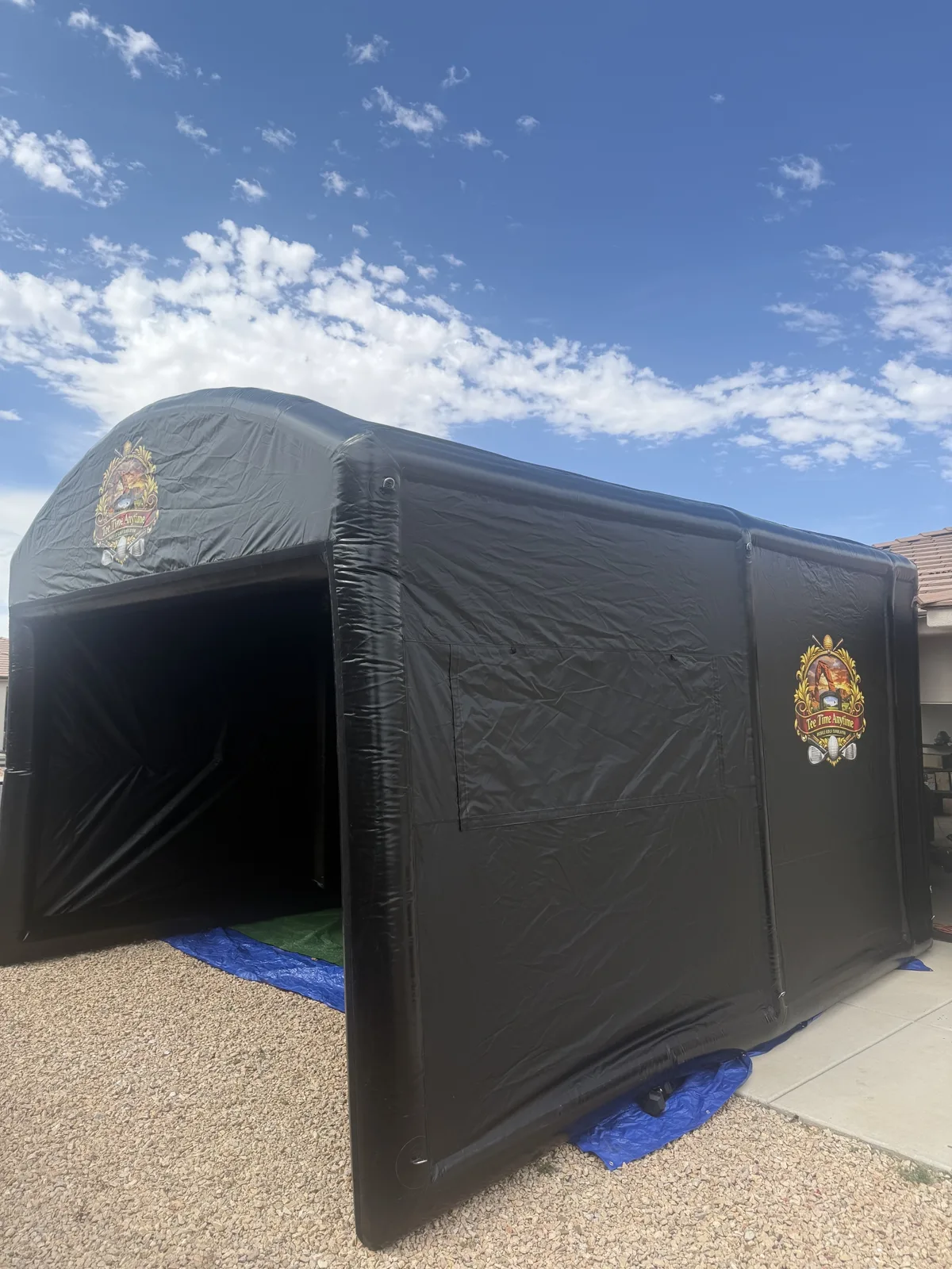 Mobile golf simulator enclosure against the Southern Utah mountains